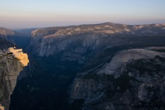Hiker on "The Diving Board" on Halfdome, Yosemite National Park